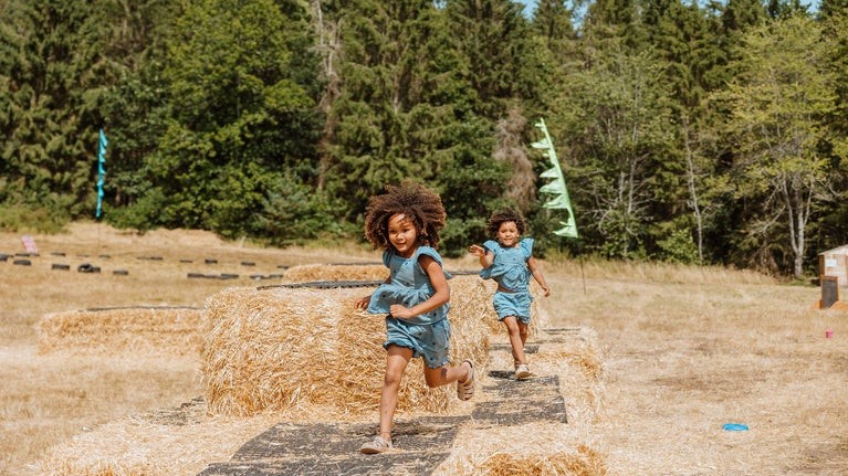 Summer of Play Comer Woods Girls on Straw bales Lucy Rebecca Photography